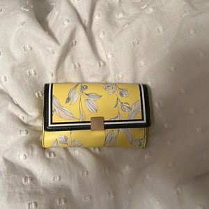 A New Day yellow trifold wallet